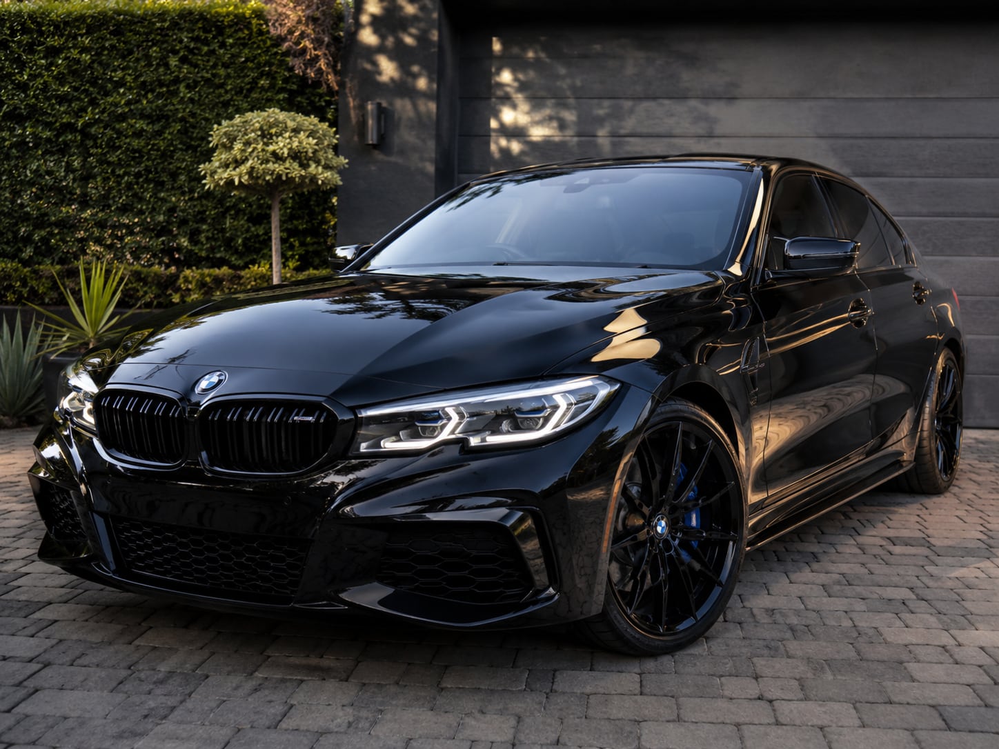Freshly detailed gloss-black BMW sedan with mirror-like paintwork, Johannesburg North